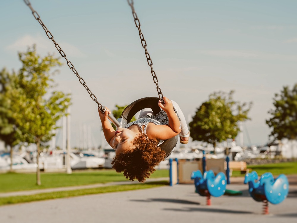 Child swinging at a park