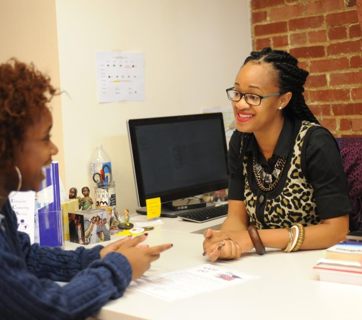 Student meeting with a staff member